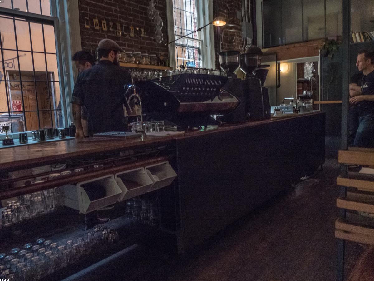 A flat white on the counter